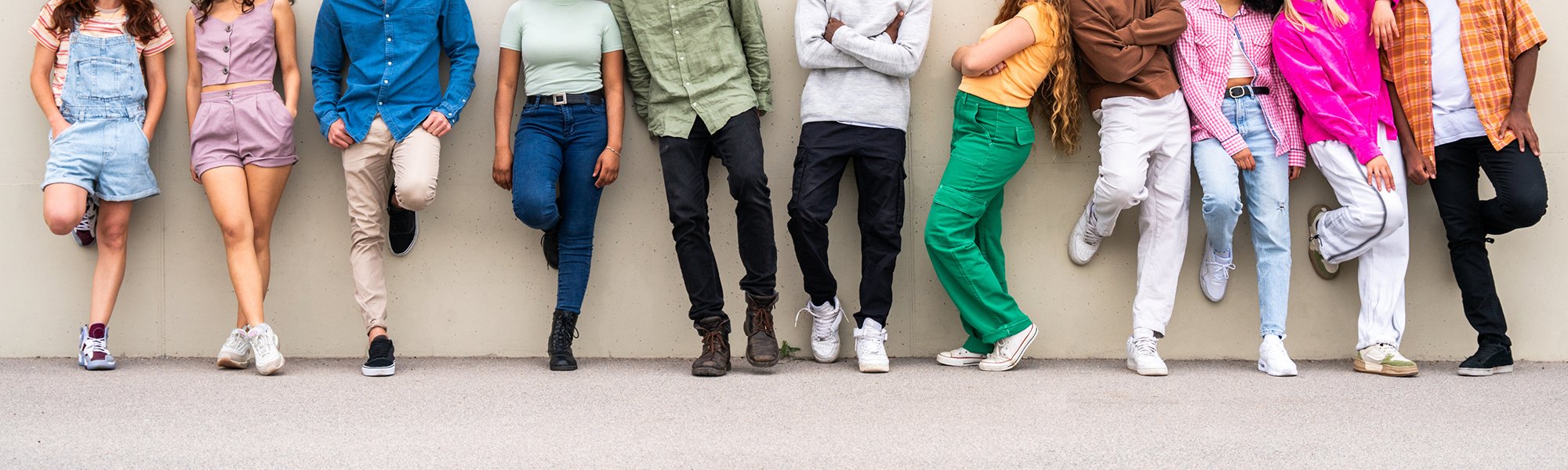 Youth leaning against a wall